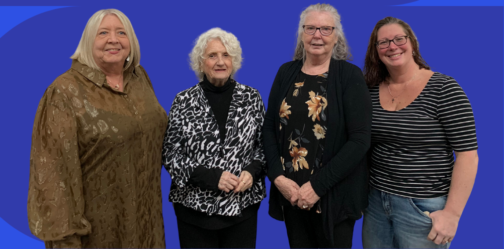 West Arthur Advisory Committee, four women smiling with a blue background 