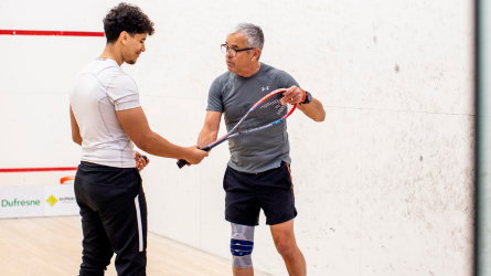two people playing squash