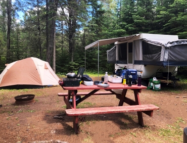 tent trailer & tent in campsite
